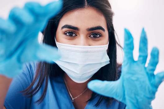 Woman, doctor and hands with face mask for healthcare, exam or busy with surgery at the hospital. Female medical expert, surgeon or nurse with latex gloves ready for checkup or examination at clinic.