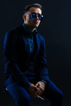 businessmen modern style suit fashion sunglasses dark background