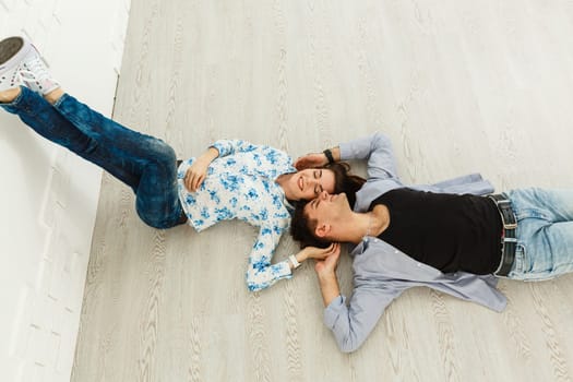 Young couple fooling around indoors.