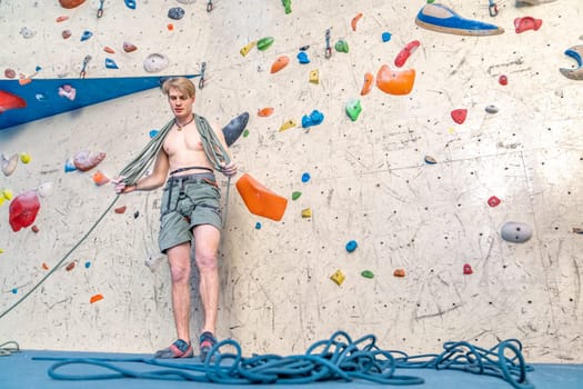 winding of a climbing rope by a young climber. High quality photo