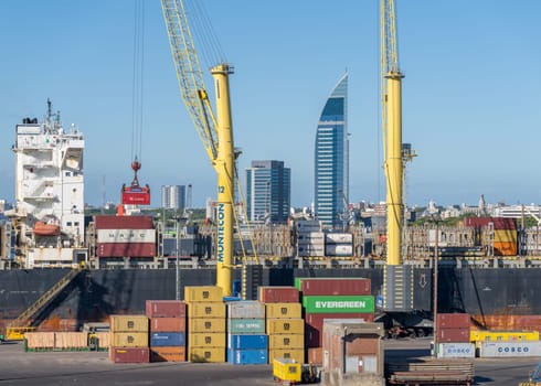 Montevideo, Uruguay - 5 February 2023: Containers being loaded onto ship in commercial port