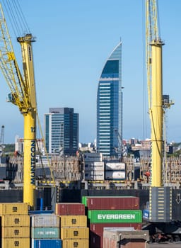 Montevideo, Uruguay - 5 February 2023: Containers being loaded onto ship in commercial port