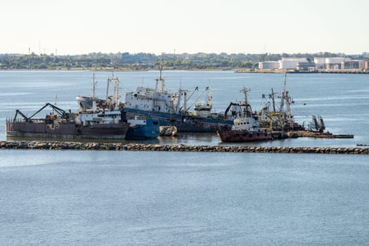 Montevideo, Uruguay - 5 February 2023:Abandoned ships rusting in shallow water in the harbor