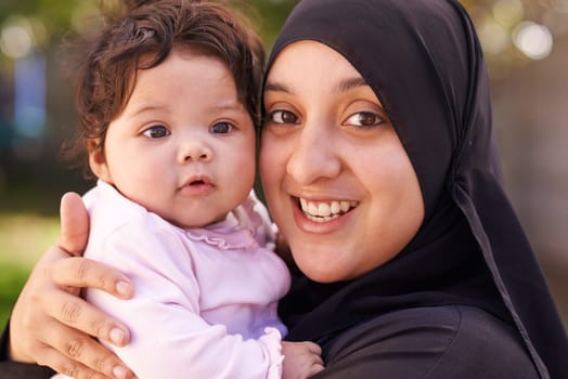 Our lives are filled with joy. a muslim mother and her little baby girl