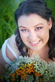 Portrait of Slavic plump chubby girl on the feast of Ivan Kupala with flowers on summer evening