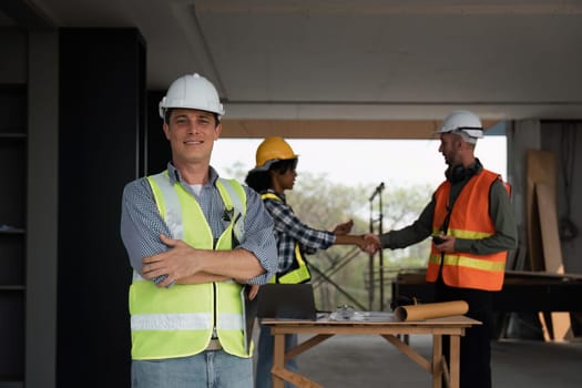 Portrait of a confident male engineer, builder and architecture at the construction site, Behind the engineer made an agreement.