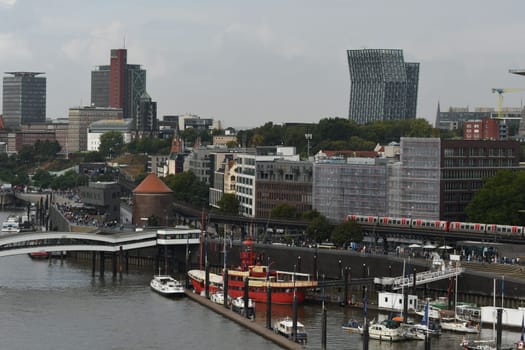 Scenic shot of harbour with a lightship and Hamburg architecture in Hamburg, Germany