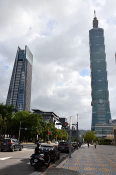 Taipei Nan Shan Plaza and Taipei 101 skyscrapers against a cloudy sky