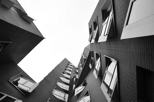 Grayscale low angle shot of Gehry buildings at the Media Harbor in Dusseldorf, Germany