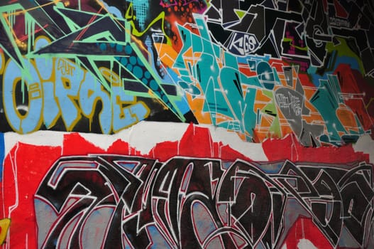 Vertical closeup of a colorful legal public graffiti wall on Tesnov Street in Prague, Czech Republic