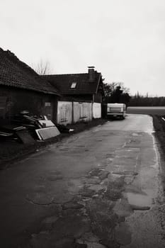 Caravan in front of run-down house on a side road near Meerbusch, Germany