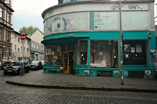 Turquoise house with glass facade in Hamburg, Germany