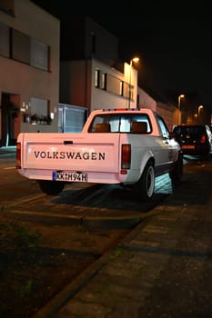 White, lowered Volkswagen Caddy on the side of the road