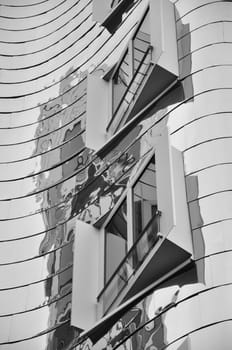 Mirrored metal facade of the Gehry buildings at the Media Harbour in Dusseldorf, Germany