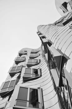 Mirrored metal facade of the Gehry buildings at the Media Harbour in Dusseldorf, Germany