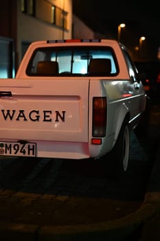 Detail of the rear of a white lowered Volkswagen Caddy on the roadside