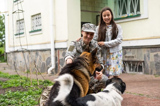 military father meeting with daughter and dogs.