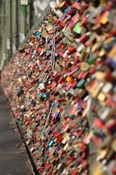 Dozens of love locks at a bridge in Cologne, Germany