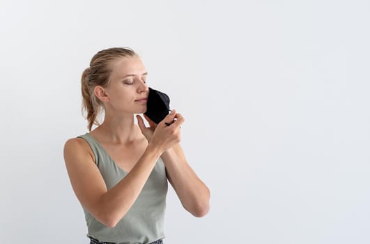 Healthcare concept. Young woman in a protective mask, portrait, close up. Copy space