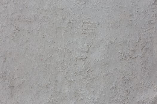 shabby dry white plaster under direct sunlight texture and full frame background