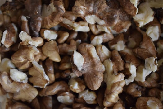 Closeup of big shelled walnuts pile. Big shelled walnuts background