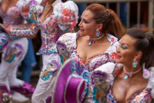 Oruro, Bolivia - February 26, 2017: Caporales dancers in ornate costumes performing as they parade through the mining city of Oruro on the Altiplano of Bolivia during the annual carnival.