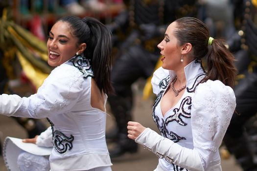 Oruro, Bolivia - February 26, 2017: Caporales dancers in ornate costumes performing as they parade through the mining city of Oruro on the Altiplano of Bolivia during the annual carnival.