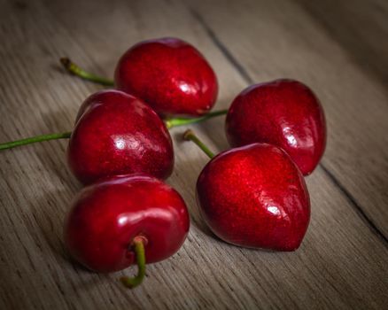 Set of five fresh red cherry fruits, close-up photo of healthy sweet food