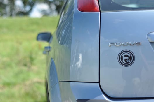Closeup shot of the back of a blue Ford Focus MK2 with a Fortuna 95 sticker on it