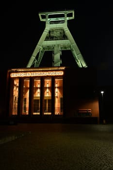 Entrance of the German Mining Museum in Bochum with an old winding tower in the background