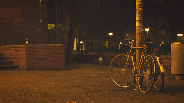 Old bicycles in lantern light in front of the Bochum Schauspielhaus, Germany