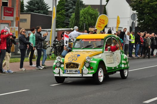 Cute green and yellow Citroen 2CV at the 2017 Tour de France in Meerbusch, Germany