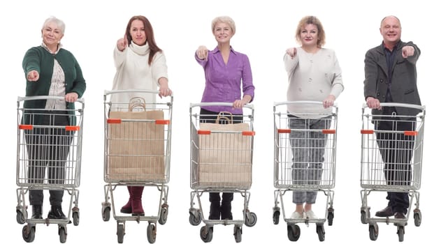 group of people with shopping cart showing thumbs up isolated on white background
