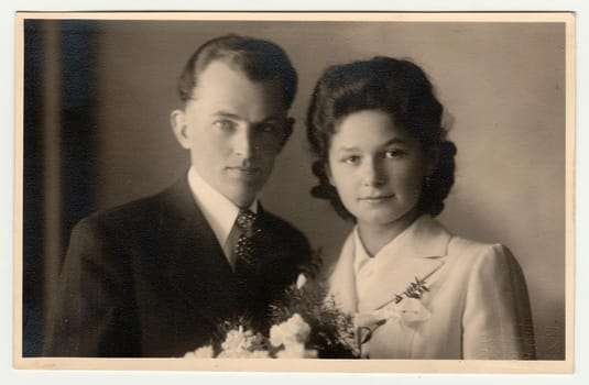 PRIBRAM, THE CZECHOSLOVAK REPUBLIC - FEBRUARY 22, 1941: Vintage photo of newlyweds