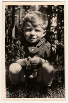 THE CZECHOSLOVAK SOCIALIST REPUBLIC - CIRCA 1960: Vintage photo shows a small boy.