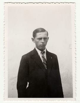 THE CZECHOSLOVAK REPUBLIC - CIRCA 1940s: Vintage photo of a young man on white background.