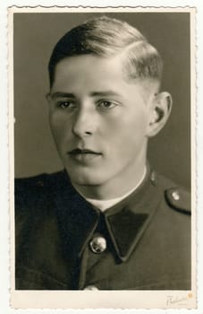 PARDUBICE, THE CZECHOSLOVAK REPUBLIC - MAY 20, 1938: Vintage studio portrait of a young soldier
