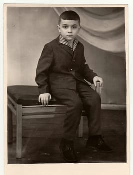 TYUMEN, USSSR - CIRCA 1950s: Vintage studio photo shows a small boy.