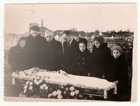 USSR - CIRCA 1970s: Vintage photo shows family grives over deceased.