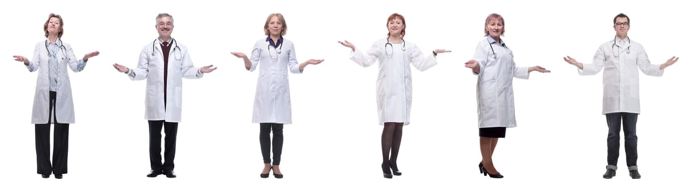 group of doctors in full length isolated on white background