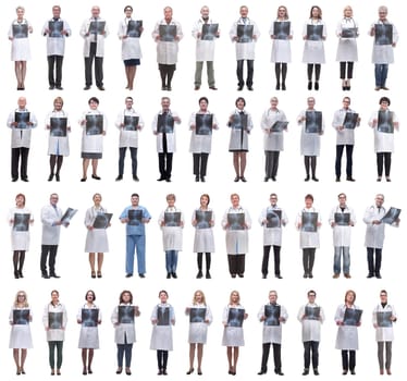 group of doctors holding x-ray isolated on white background