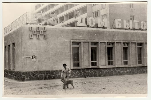 USSR - CIRCA 1970s: Vintage photo shows woman walks the dog.