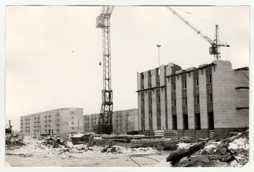 USSR - CIRCA 1970s: Vintage photo shows construction of blocks of flats in USSR. Winter time.