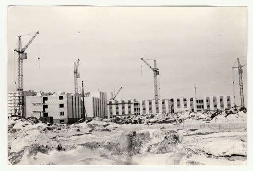 USSR - CIRCA 1970s: Vintage photo shows construction of blocks of flats in USSR. Winter time.