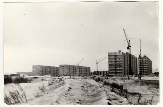 USSR - CIRCA 1970s: Vintage photo shows construction of blocks of flats in USSR. Winter time.