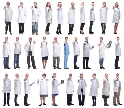 group of doctors in full length isolated on white background