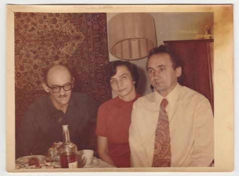 USSR - CIRCA 1970s: Vintage photo shows family during feast.