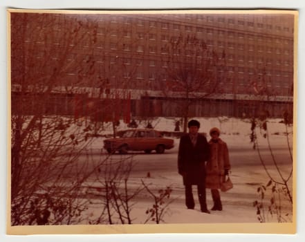 USSR - CIRCA 1970s: Vintage photo shows couple poses on the street in winter.