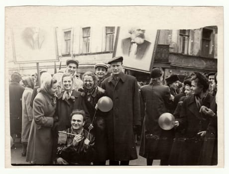 USSR - CIRCA 1960s: Vintage photo shows people celebrate May Day (International Workers' Day). Picture of Karel Marx on background.