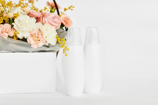 cosmetic beauty product bottle mockup with natural ingredient and spring flower. natural concept. copy space